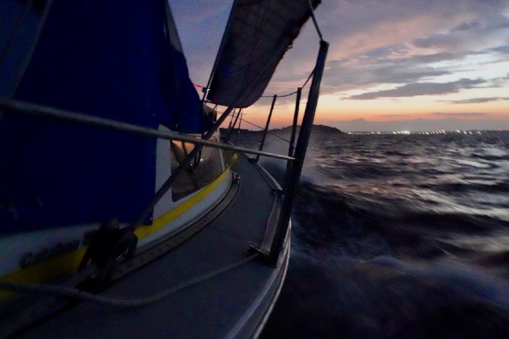 Sailing Solitude home after sunset