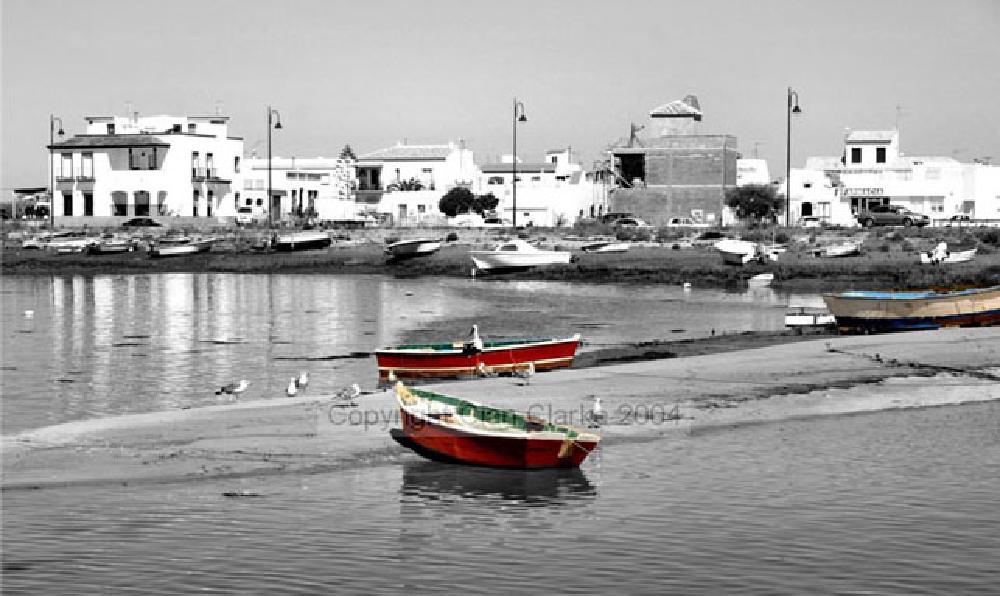 Partial black & white of fishing boats in Isla Christina